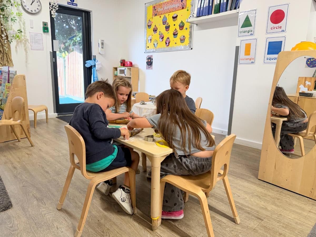 Unique child montessori children engaged in table activity