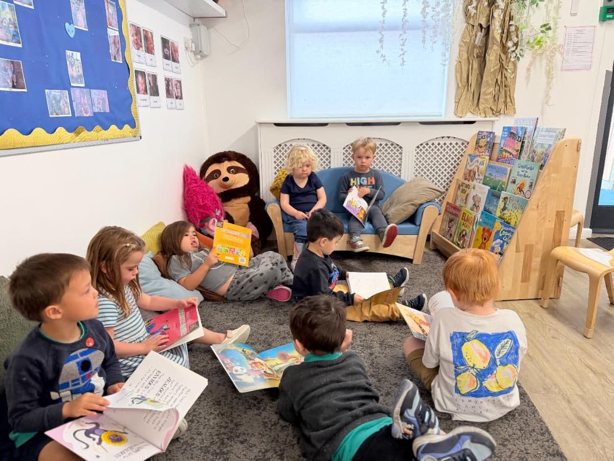 Unique child montessori children reading books together